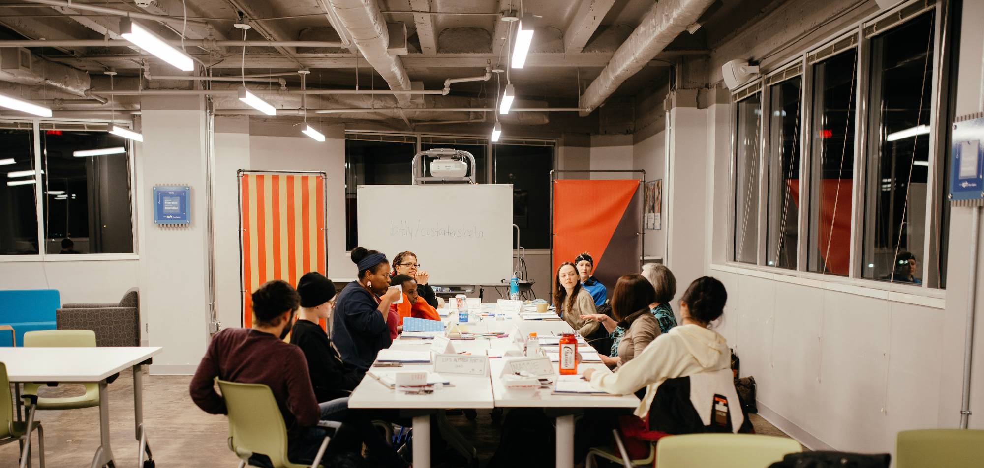 members working around a conference room table